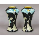 A pair of Black Ryden waisted vases, designed by Kerry Goodwin in the Papaver pattern, 16.5cm (2)