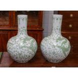 A pair of modern Chinese porcelain bottle vases, decorated with dragons and phoenix, bearing six