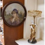 An Art Noveau style parcel gilt composite figural table lamp with beaded tassel shade; together with