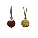 A locket formed of carnelian and a George III Spade Guinea dated 1790, on a trace link chain,