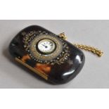 A Brass and Mother-of-Pearl Inlaid Tortoiseshell-Purse, oblong, the front set with a timepiece