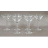 A set of six Stuart crystal champagne glasses, designed by Jasper Conran