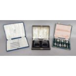 A Collection of Cased Sets of Silver Flatware, including: three cased sets of six tea or coffee-