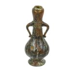 A Chinese bronze vase, in Archaic style, of fluted pear shape with twin handles and bands of taotie,