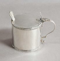 A George III Silver Mustard-Pot, by Charles Aldridge, London, 1793, drum-shaped and with scroll