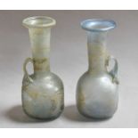 Two Roman-style glass ewers, largest 18.5cm Slightly different heights and colours, both free from