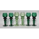 Twelve German Bohemian coloured glass roemers