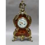 A French faux tortoiseshell gilt metal mounted striking mantel clock, retailed by Ant Roetig, Paris,