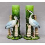 A pair of Bretby aesthetic movement vases, each surmounted by a crane, impressed marks, 29.5cm