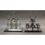 A silver plated six bottle cruet set, an egg set, fluted teapot and a hot water jug; together with a