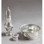 Three Silver Items, comprising: a caster, Birmingham, 1930, 18cm high; a bowl, the sides applied