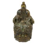 A Chinese gilt, painted and lacquered bronze figure of a Deity, possibly Guandi, Qing Dynasty,