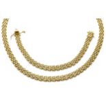 An 18 carat bi-coloured gold necklace and bracelet suite, length 42.5cm and 17.2cmGross weight 38.