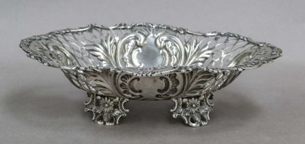 A Victorian Silver Sweetmeat-Dish, by William Hutton and Sons Ltd., London, 1897, oval and on four
