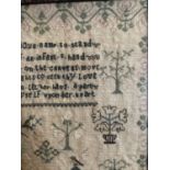 Early 19th Century Sampler with a verse to the top worked in black, surrounded by flowering trees,