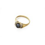 A sapphire and diamond ring, finger size OThe ring is in good to fair condition, with abrasion and a