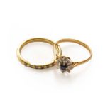 An 18 carat gold diamond half hoop ring, finger size O1/2; and a sapphire and diamond cluster