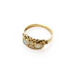 An 9 carat gold opal and diamond ring, finger size OGross weight 3.5 grams.