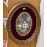 A Sèvres style porcelain plaque, late 19th century, of oval form, painted with a mother and children