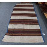 Afghan flatweave, the field of narrow and wide bands of geometric motifs, 297cm by 123cm; together