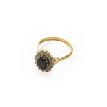 An 18 carat gold sapphire and diamond cluster ring, finger size QThe ring is in good condition