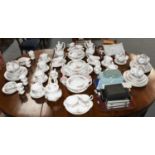 An extensive Royal Albert Moss Rose pattern dinner, tea and coffee service, to include: 3 tureens, 2