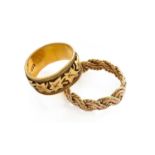 An 18 carat gold textured band ring, finger size K; a 9 carat gold textured band ring, finger size