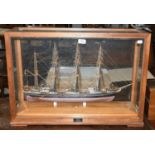 A cased model of a four-masted ship, S V Caroline, made by C G Stanistreet, Liverpool, 74cm by