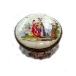 An 18th century Birmingham enamel circular box with hinged cover, painted with a man and a woman