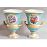 A pair of Derby campana shaped vases, circa 1820, turquoise ground, gilded and with circular