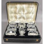 A George V cased silver and cut glass strawberry set comprising: sugar bowl, cream jug, six bowl,
