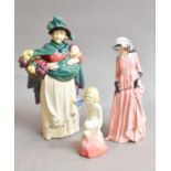 A Royal Doulton figure of a street trader 'The Flower Seller', designed by Leslie Harradine,