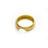 An 18 carat gold band ring, finger size OThe ring is shaped to fit around an engagement ring.