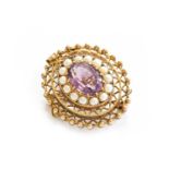 An amethyst and split pearl brooch/pendant, with applied plaque stamped '9CT', length 4.7cmGross