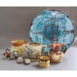 A Poole pottery charger, stoneware including Doulton, Staffordshire loving cups, etc