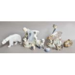 Copenhagen figures, including a milkmaid, polar bear and various others, and a Royal Doulton dog (