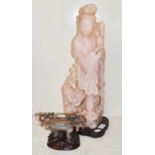 A large Chinese rose quartz figure of Guanyin and a Chinese carved hardstone censor on wooden