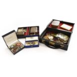 A quantity of costume jewellery including brooches, paste set jewellery, a compact etc; together