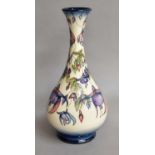 A modern Moorcroft pottery Fuchsia pattern vase, factory marks and brown painted M.C.C 2001, 31.