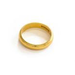 A 22 carat gold band ring, finger size OThe ring is in good condition with slight surface