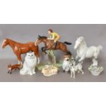 Three Beswick Horses, one with a rider vaultubg a fence, other Beswick animals, Staffordshire