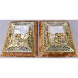 A pair of brass twin branch girandoles with bevelled mirror plates, open fretwork borders and