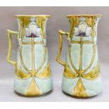 A pair of Minton Secessionist No.13 jugs, with tube lined stylised decoration in green, turquoise