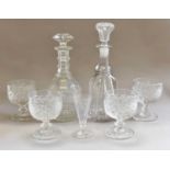 A pair of 19th century glass three-ring decanters and stoppers flat cut and with hobnail banding,