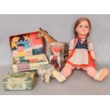 A Steiff Okapi, similar elephant, Vulcan junior sewing machine, and three circa 1960's dolls