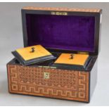 A 19th century coromandel tea caddy with parquetry inlay and brass escutcheon, the internal