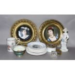 A pair of early 20th century German porcelain portrait plaques in gilt brass frames, together with a