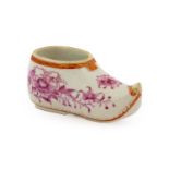 A Chinese porcelain miniature shoe, Qianlong, painted in puce monochrome with flowersprays within