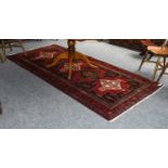 Nahavand Rug, the stepped linked medallion field enclosed by triple narrow borders, 292cm by 137cm