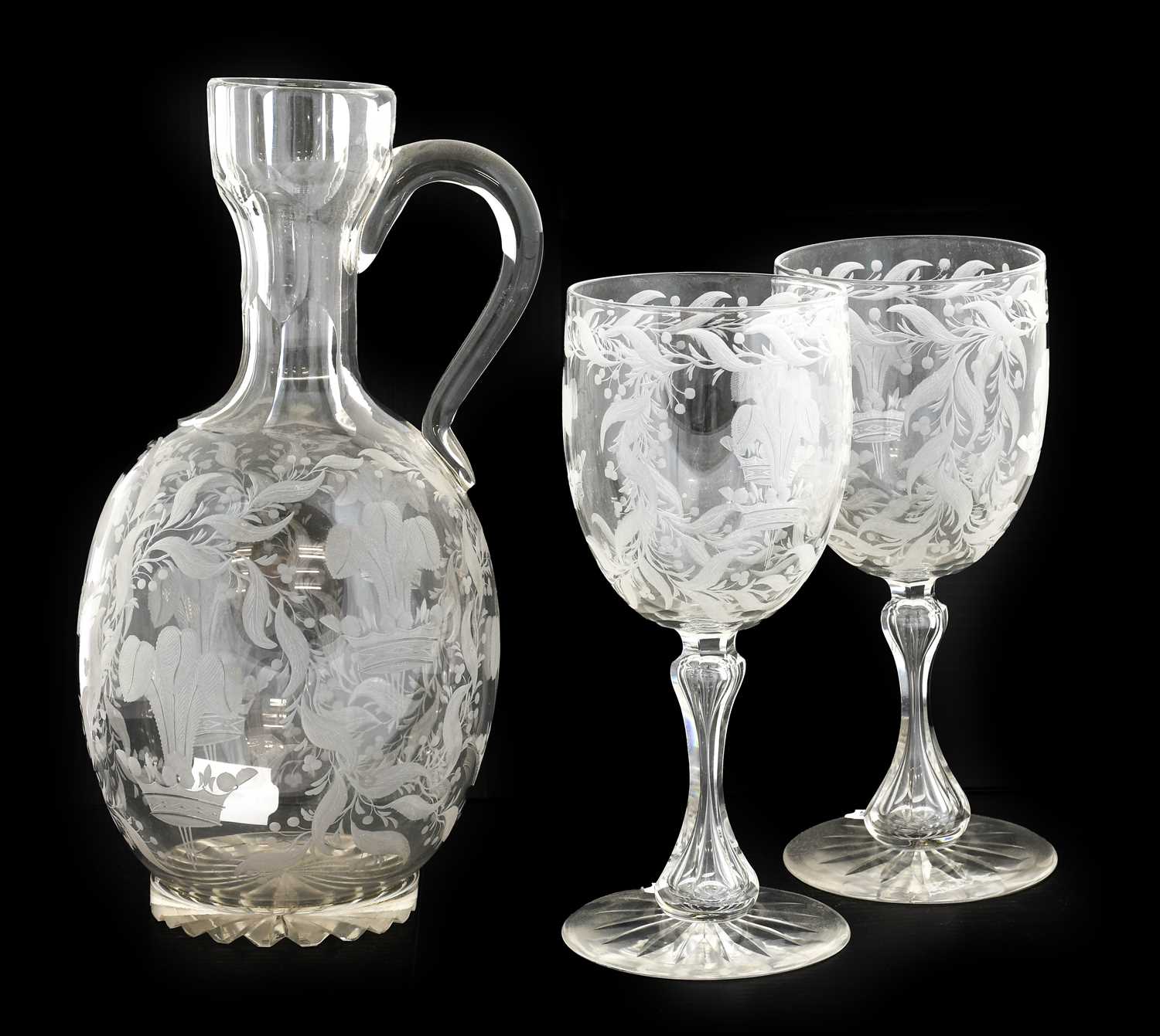 Of Royal Interest: An Engraved Glass Water Set, circa 1870, as an ewer of ovoid form with panel neck